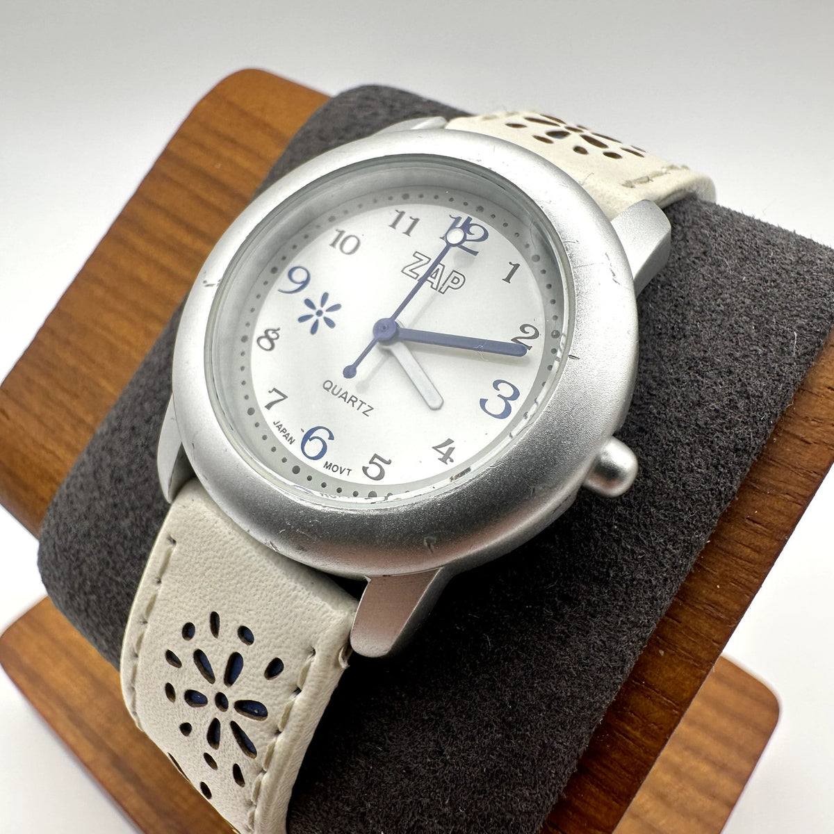 ZAP Quartz Watch Silver Tone Case White Floral Cutout Leather Strap